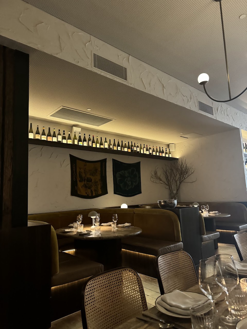 Palazzo Salato booth seating and warm dining room lighting