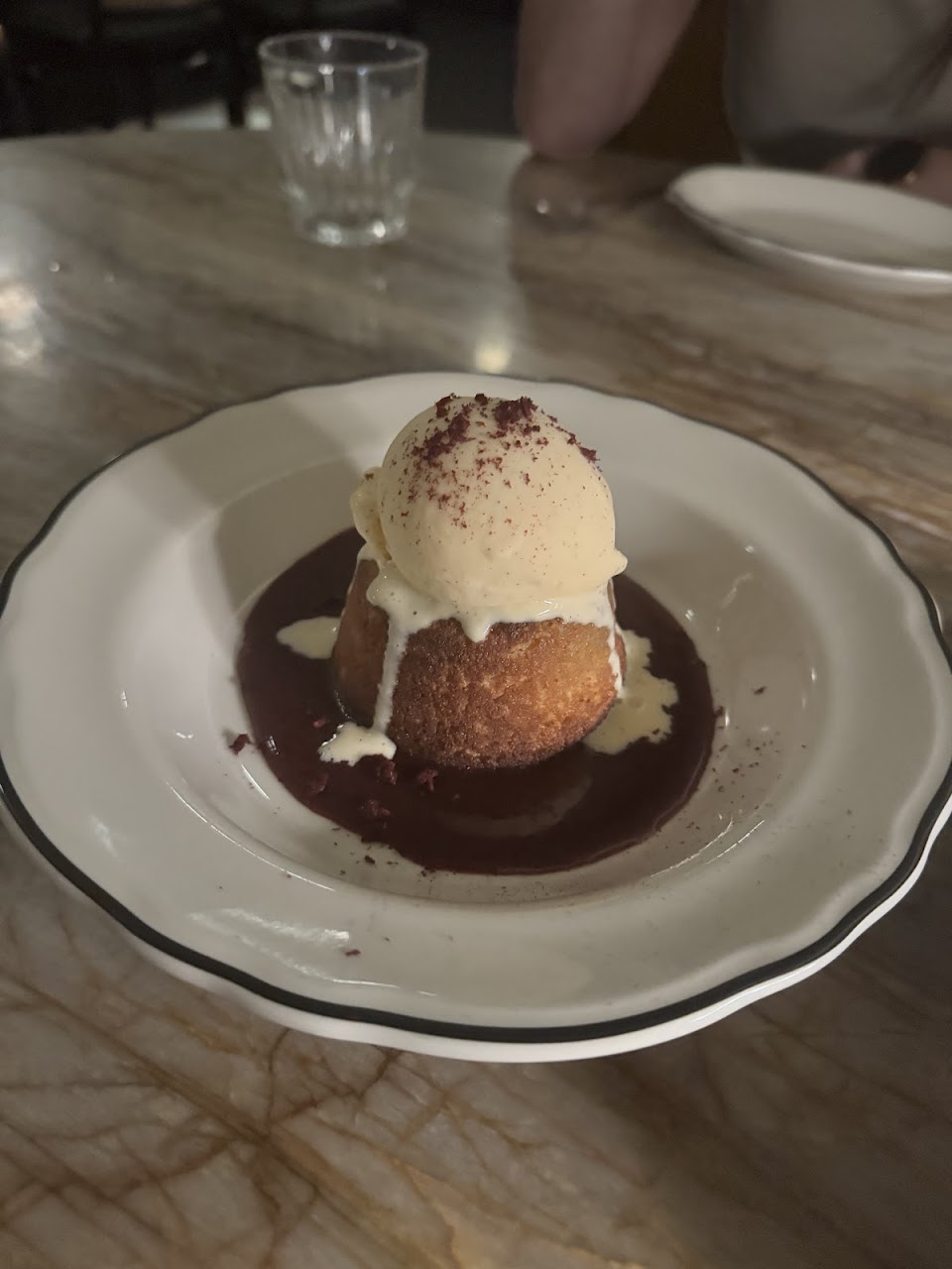 Dessert served with dark sauce at Palazzo Salato